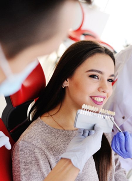 Woman smiling during consultation with Manchester cosmetic dentist