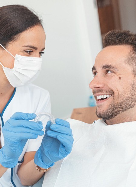 Dentist talking to patient about Invisalign