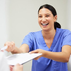 Patient paying for tooth extraction