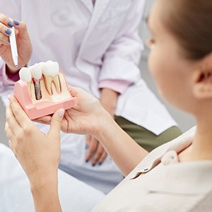 dentist discussing dental implant with patient 