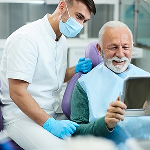 mature patient happy about his dental implant result 