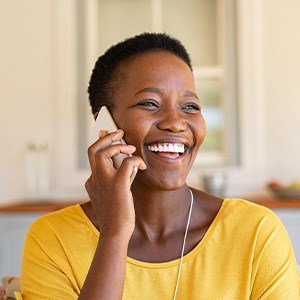 Woman smiling while talking on phone