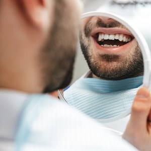 Patient looking at smile in reflection