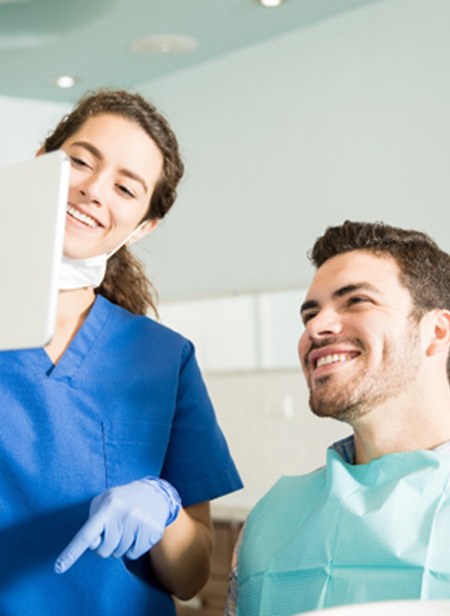 Manchester dentist talking to patient about cosmetic dental bonding
