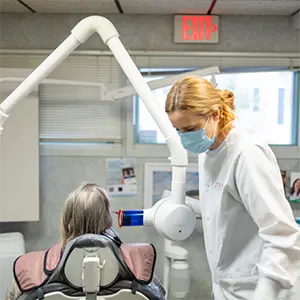 Patient looking at digital x-rays on tablet computer
