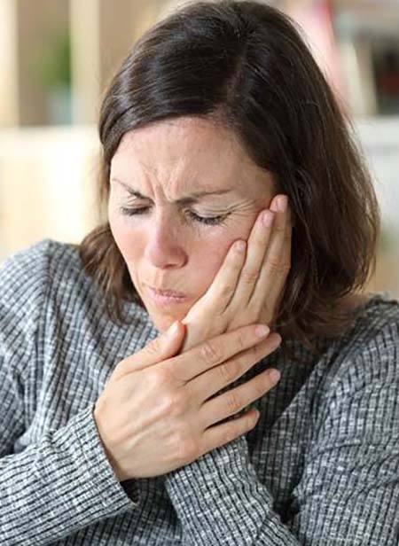 Woman with a toothache in Manchester