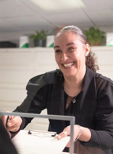 couple smiling discussing dental financing