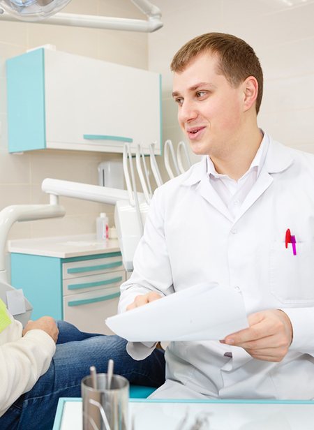 Implant dentist in Manchester explaining treatment to a patient