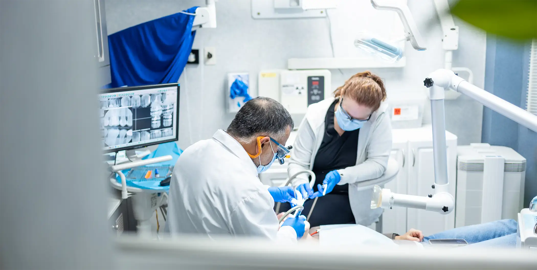 Webster Dental Associates of Manchester dentist and team members smiling outdoors