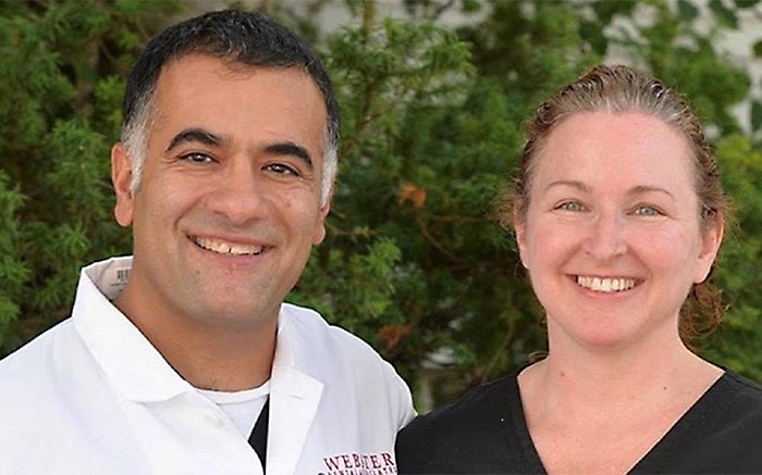 Two smiling Manchester dental team members