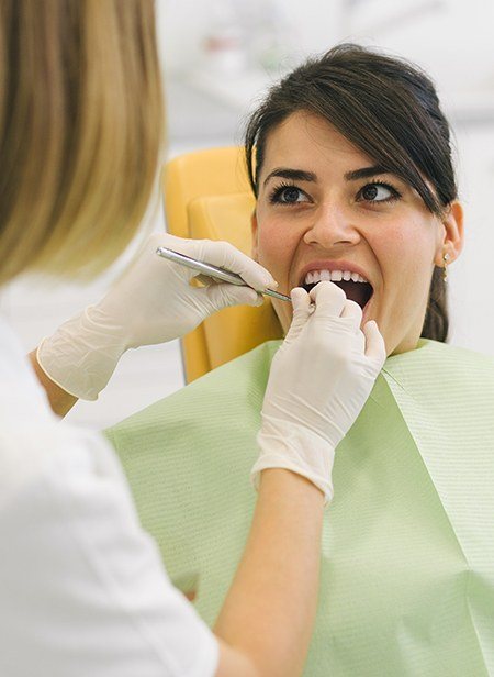 Woman receiving preventive dentistry checkup