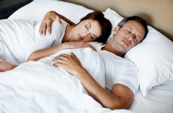 Man and woman sleeping soundly after sleep apnea treatment