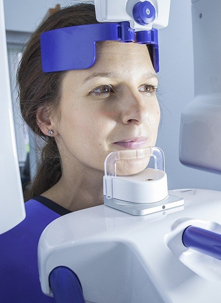 Woman receiving 3 D C T cone beam x-ray scan