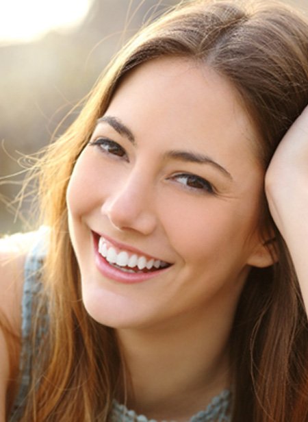 woman smiling after getting veneers in Manchester