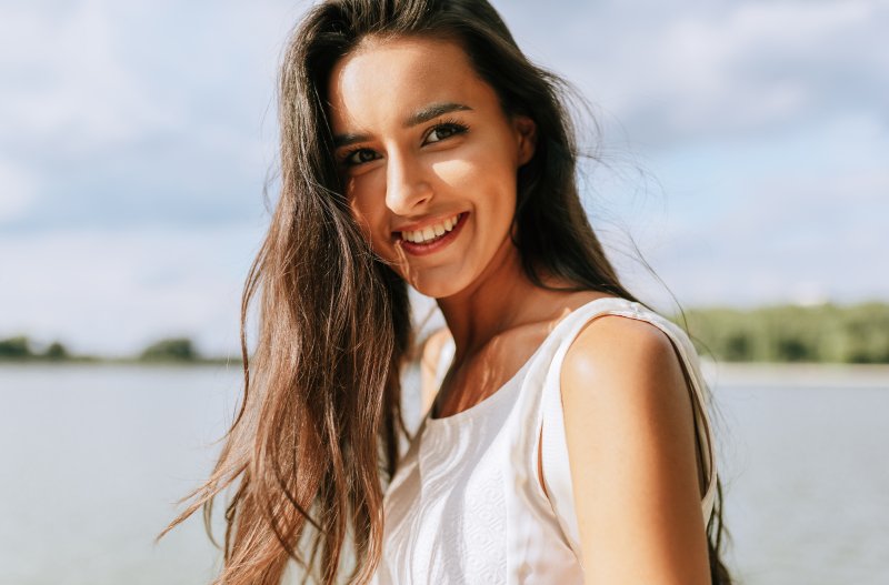 young woman smiling during summer