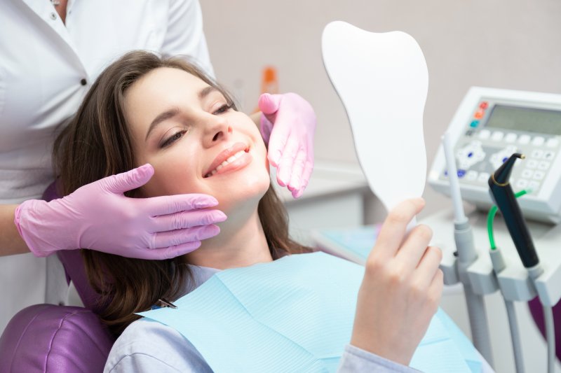 patient smiling after getting veneers in Manchester 