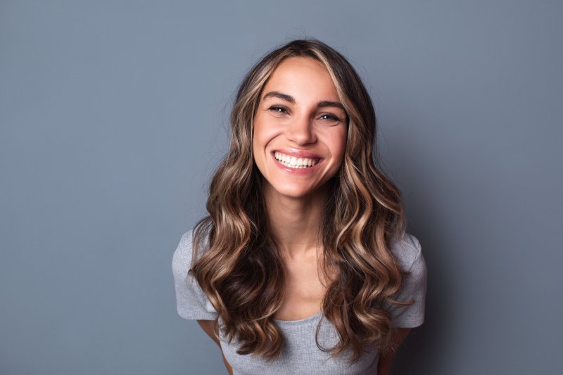 person with dental implants smiling