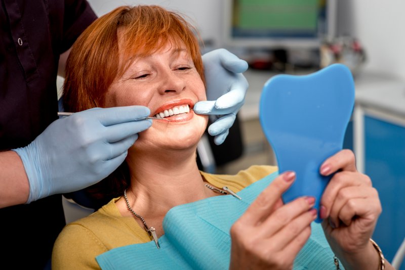 woman seeing dentist for dentures