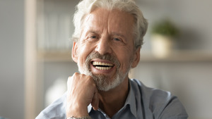 Close-up of bearded senior man smiling